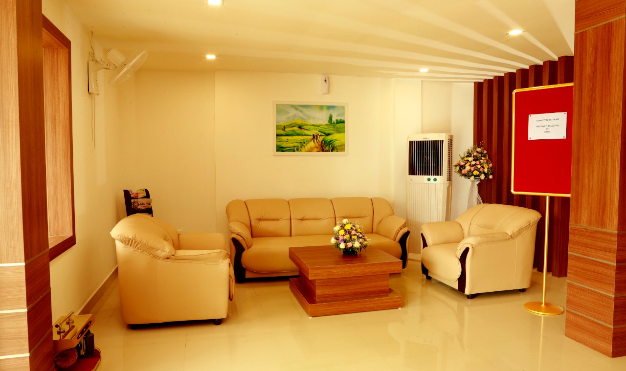 Plush executive waiting lounge with newspapers and decor